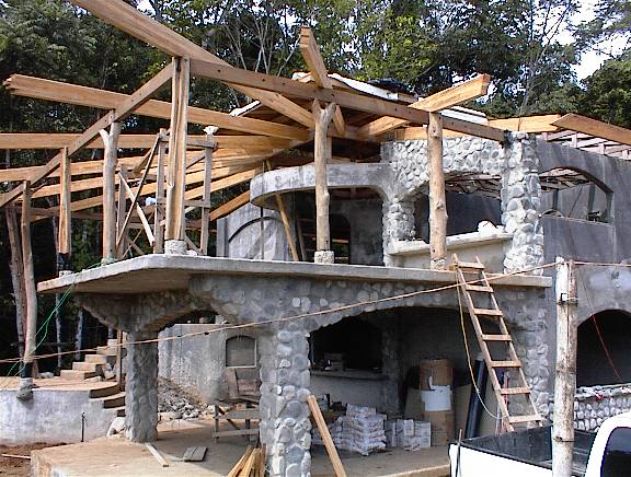 Wooden Laminated Beams produced by Rarewood in Puerto Jimenez and installed on the roof structure of a forest house in the Osa Peninsula